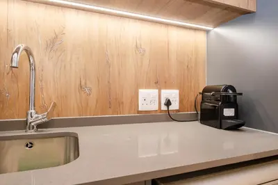 a kitchen with a sink and a toaster on a counter at 723 Riverlands - Lux 1 bedroom Apartment in Cape Town