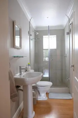 a bathroom with a toilet and a sink and a shower at Sipres Garden in Durbanville
