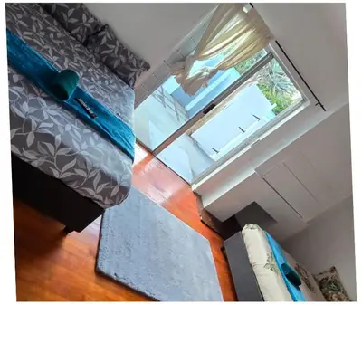 a view of a bedroom with a window and a bed at Ridah's Accomodation in Bellville
