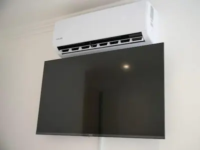 a television with a box on top of it at Cherrywood Guest House in Cape Town