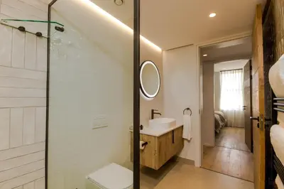a bathroom with a sink and a shower at Stylish Apartment in Cape Winelands District in Stellenbosch
