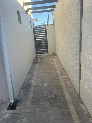 a hallway with a door in the side of a building at Home Away From Home 6 minutes away from beach in Cape Town