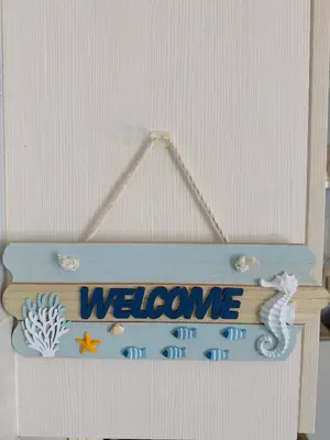 a welcome sign on a door with the word welcome at Blouberg Beach Gem 5 Min Walk in Cape Town