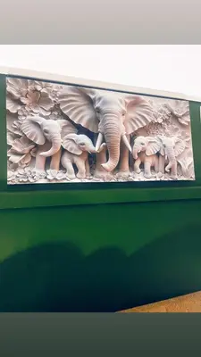 a painting of a group of elephants on a shelf at Explore Convenience And Style In A Prime Location in Richwood