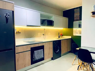 a kitchen with a washer and dryer in it at Explore Convenience And Style In A Prime Location in Richwood