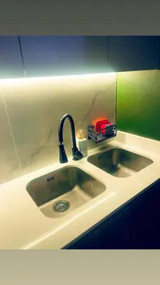 a kitchen sink with a faucet on top of it at Explore Convenience And Style In A Prime Location in Richwood