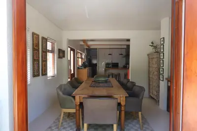 a kitchen and dining room with a table and chairs at Greyton Hideaway-on-Disa in Greyton
