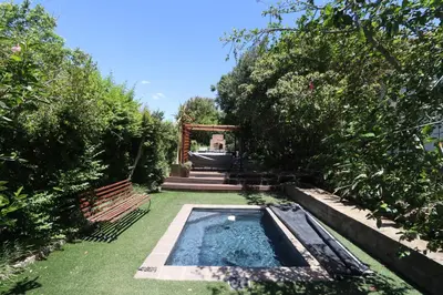 a garden with a pool of water in a yard at Greyton Hideaway-on-Disa in Greyton