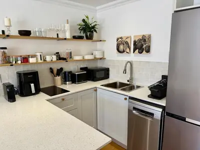 a kitchen with a sink and a counter top at The Sultan Cottage in Stellenbosch