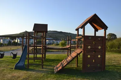 an outdoor playground with a slide and a slideintend at Casa Voliere in Stellenbosch