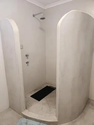 a shower with an archway in a bathroom at Home in Somerset Ridge in Somerset West