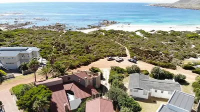 an aerial view of a house and the beach at The Sandpiper - The Alikreukel , Pringle Bay in Pringle Bay