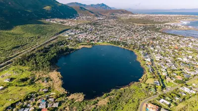 an aerial view of a city next to a lake at Onrus Family Retreat in Hermanus