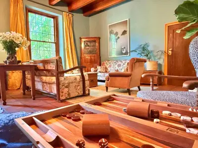 a living room with a couch and a table at Die Jonkmanshuis in Stellenbosch