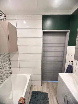a bathroom with a shower and a tub and a toilet at 29 on Windsor-2 Bedroom House in Silver Sands
