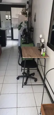 a room with a table and a chair in a room at A Stone's Throw away in Cape Town