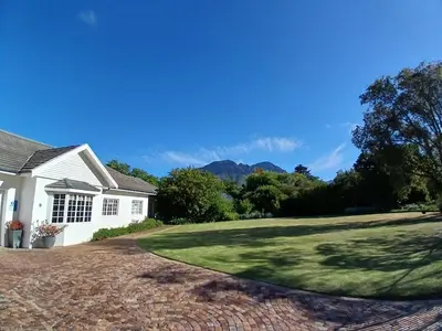a house with a brick driveway at Spacious Family Home - Windsor Retreats in Somerset West