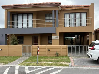 a house with a car parked in front of it at SNE Travellers in Faure