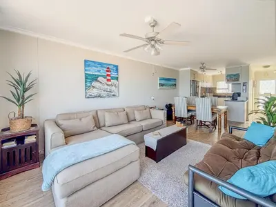 a living room with a couch and a table at 510 Odeon Towers - SeaView in Strand