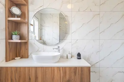 a bathroom with a sink and a mirror at Bella View in Cape Town