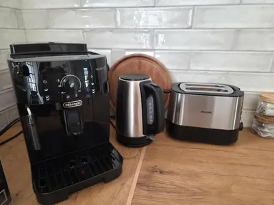 a coffee maker sitting on a counter next to a toaster at Swallows Nest Garden Cottage in Helderberg
