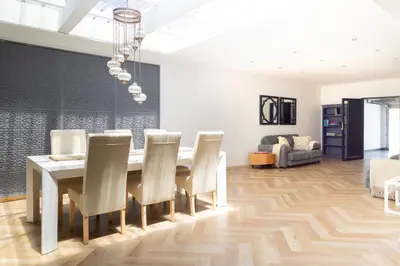 a dining room with a table and chairs at Villa Noor Modern 2 Bed Luxury Retreat in Hanover Park