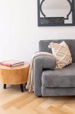 a living room with a couch and a coffee table at Villa Noor Modern 2 Bed Luxury Retreat in Hanover Park