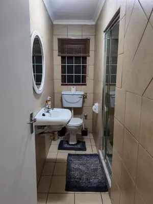 a bathroom with a sink and a toilet and a shower at Central, Spacious GF Apartment, access to N1,N2,M5