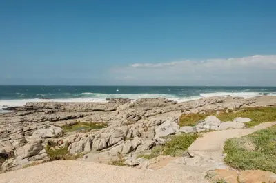 a rocky beach with the ocean in the background at Hermanus Beach Club 218 in Hermanus