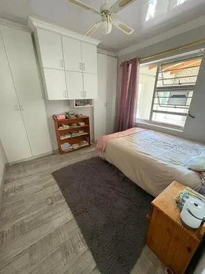 a bedroom with a bed and a window at North of the vines in Oakdale