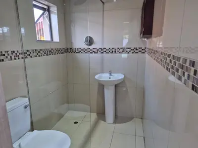 a white bathroom with a sink and a toilet at Maglovir economy 3 BEDROOMS BULK in Tiervlei