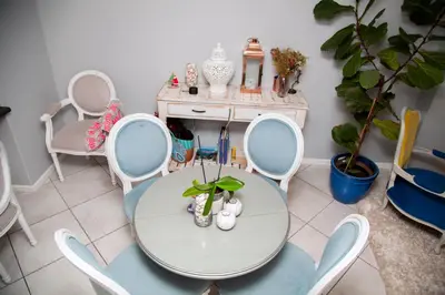 a room with a table and chairs and a desk at Divine Favor House on 44 Torrington in Cape Town