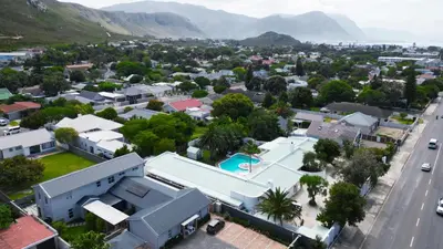 an aerial view of a small town with mountains at Northcliff House in Hermanus