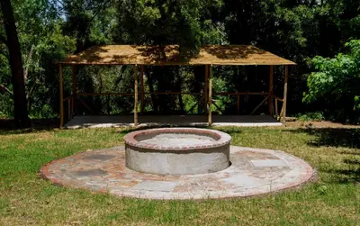 a large circle in the grass with a gazebo at The Lineage Lodge in Elgin