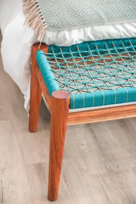 a wooden bench with a mattress on top of a bed at Abalone at Hermanus Reefs in Hermanus
