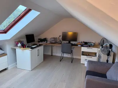 an attic room with a desk with a computer on it at Modern & Secure 3-Bed Home with Pool & Garden in Cape Town