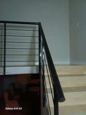 a spiral staircase in a room with a floor at On The Bay in Strandfontein