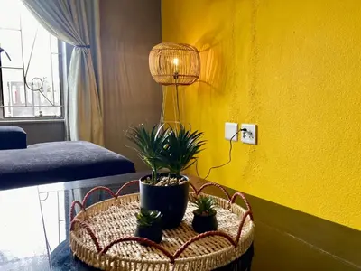 a room with a table with potted plants on it at Unit 1, TraversHub Sleeps 6 Self-Catering Group Belhar, CT in Belhar