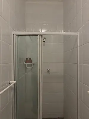 a shower with a glass door in a bathroom at Sea and Vlei on Disa in Bettyʼs Bay