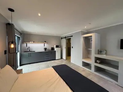 a room with a kitchen and a living room at One-Bedroom apartment in Somerset West in Helderberg
