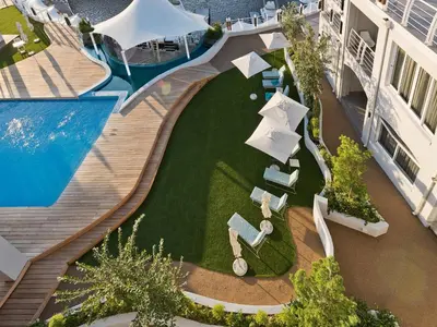an overhead view of a swimming pool at a resort at Krystal Beach Hotel in Gordonʼs Bay