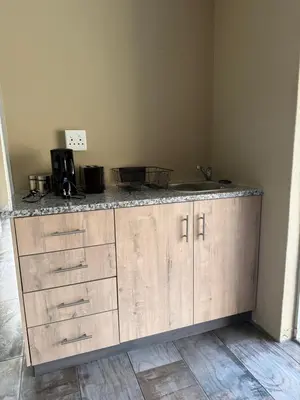 a kitchen with a counter with a sink at Kabana Guest House Morgenzicht in Windsor Park