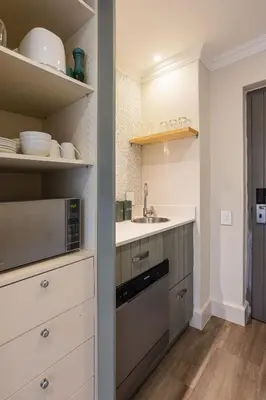 a kitchen with a sink and a microwave at Winelands Luxury Accommodation in Stellenbosch