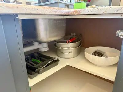 a kitchen shelf with various kitchen utensils on it at Welcome Home in Somerset West