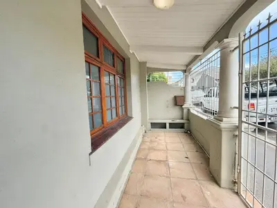 an empty porch of a building with a window at 3 Bedroom Vintage Home in Cape Town