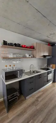 a large kitchen with a sink and a stove at Ebbies place in Cape Town