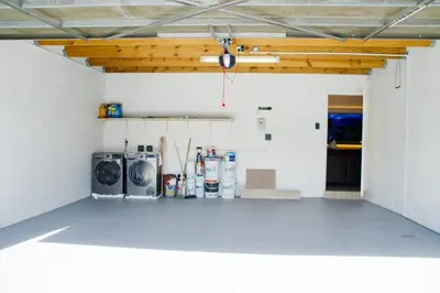a garage with a washer and dryer in a room at Milino Guest House in Cape Town