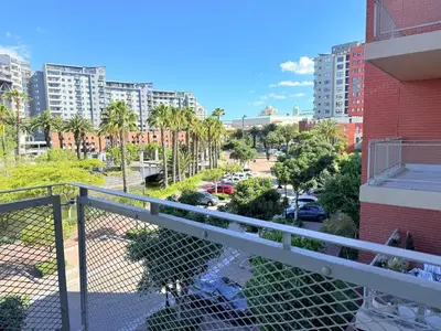 a balcony with a view of a city at Luxe Manhattan Quarters in Cape Town