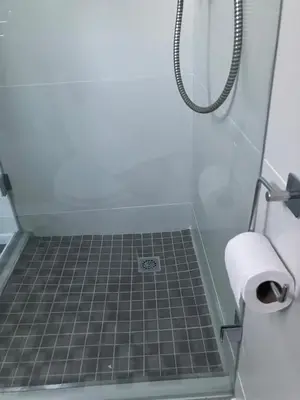 a bathroom with a shower with a toilet paper roll at Starry Starry Night Loft, with Aircon in Die Boord in Stellenbosch