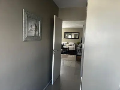 an open door to a room with a living room at Aquarius Luxury Suites 406 in Cape Town